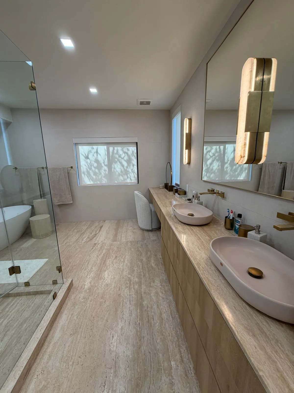 Double vanity, natural stone — One Direct Mill project in South Florida